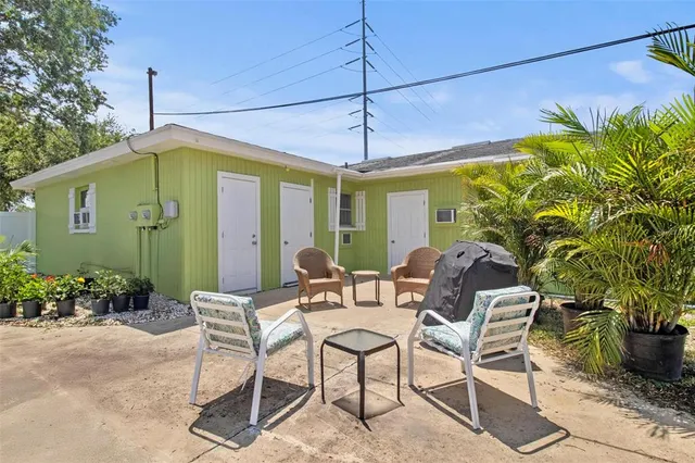 a view of a chairs and table in the patio