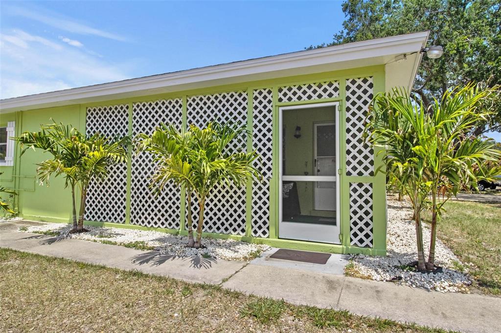 504 Milwaukee Avenue, Unit A Dunedin, FL 34698 - Photo 24 of 27 a front view of a house with a street