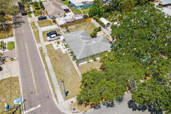 an aerial view of a residential apartment building with a yard