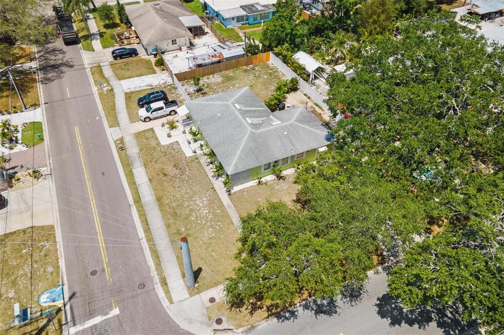 504 Milwaukee Avenue, Unit A Dunedin, FL 34698 - Photo 26 of 27 an aerial view of a residential apartment building with a yard