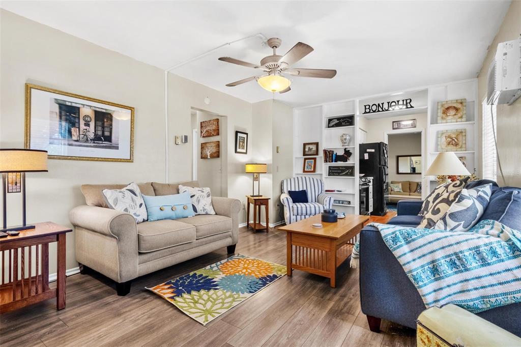 504 Milwaukee Avenue, Unit A Dunedin, FL 34698 - Photo 8 of 27 a living room with furniture and wooden floor