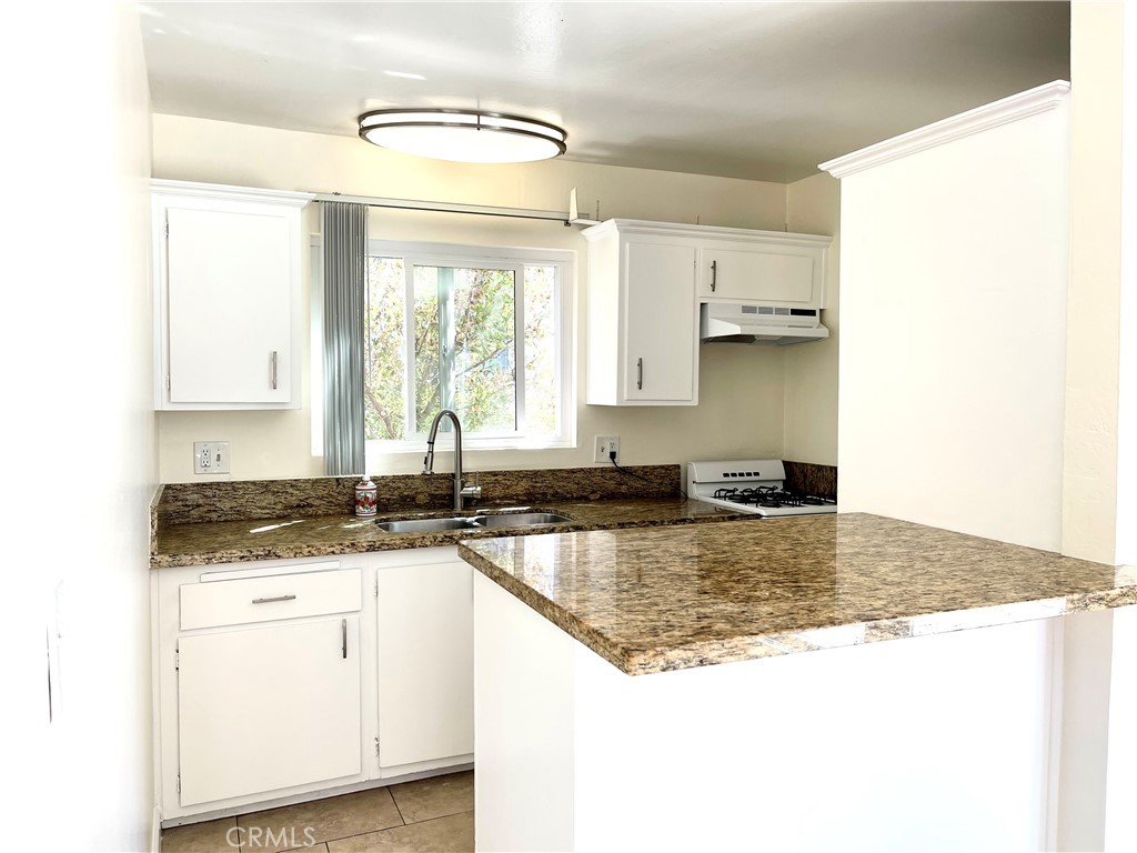 25091 La Cresta Drive Dana Point, CA 92629 - Photo 13 of 13 a kitchen with granite countertop a sink a counter top space and cabinets