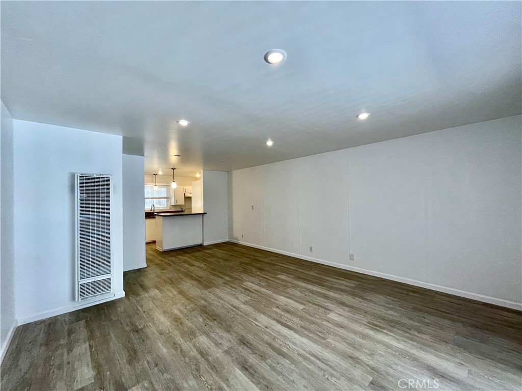 25091 La Cresta Drive Dana Point, CA 92629 - Photo 4 of 13 a view of kitchen and empty room with wooden floor