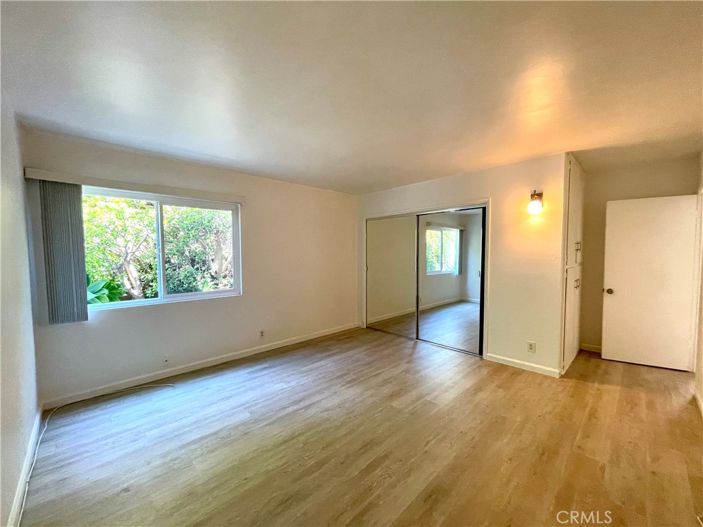 25091 La Cresta Drive Dana Point, CA 92629 - Photo 7 of 13 an empty room with wooden floor and windows
