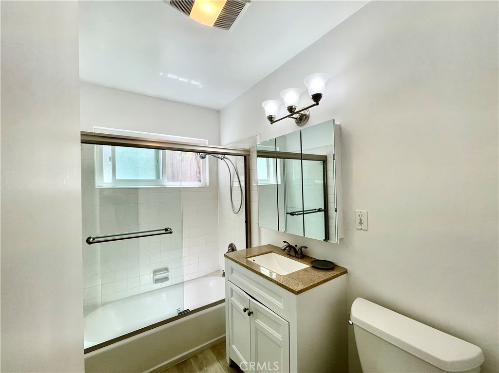 25091 La Cresta Drive Dana Point, CA 92629 - Photo 8 of 13 a bathroom with a granite countertop sink a toilet and mirror