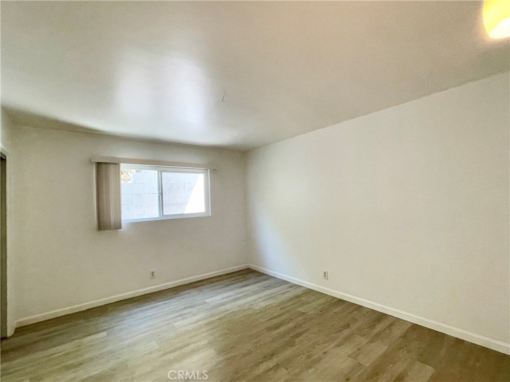 25091 La Cresta Drive Dana Point, CA 92629 - Photo 9 of 13 an empty room with wooden floor and windows