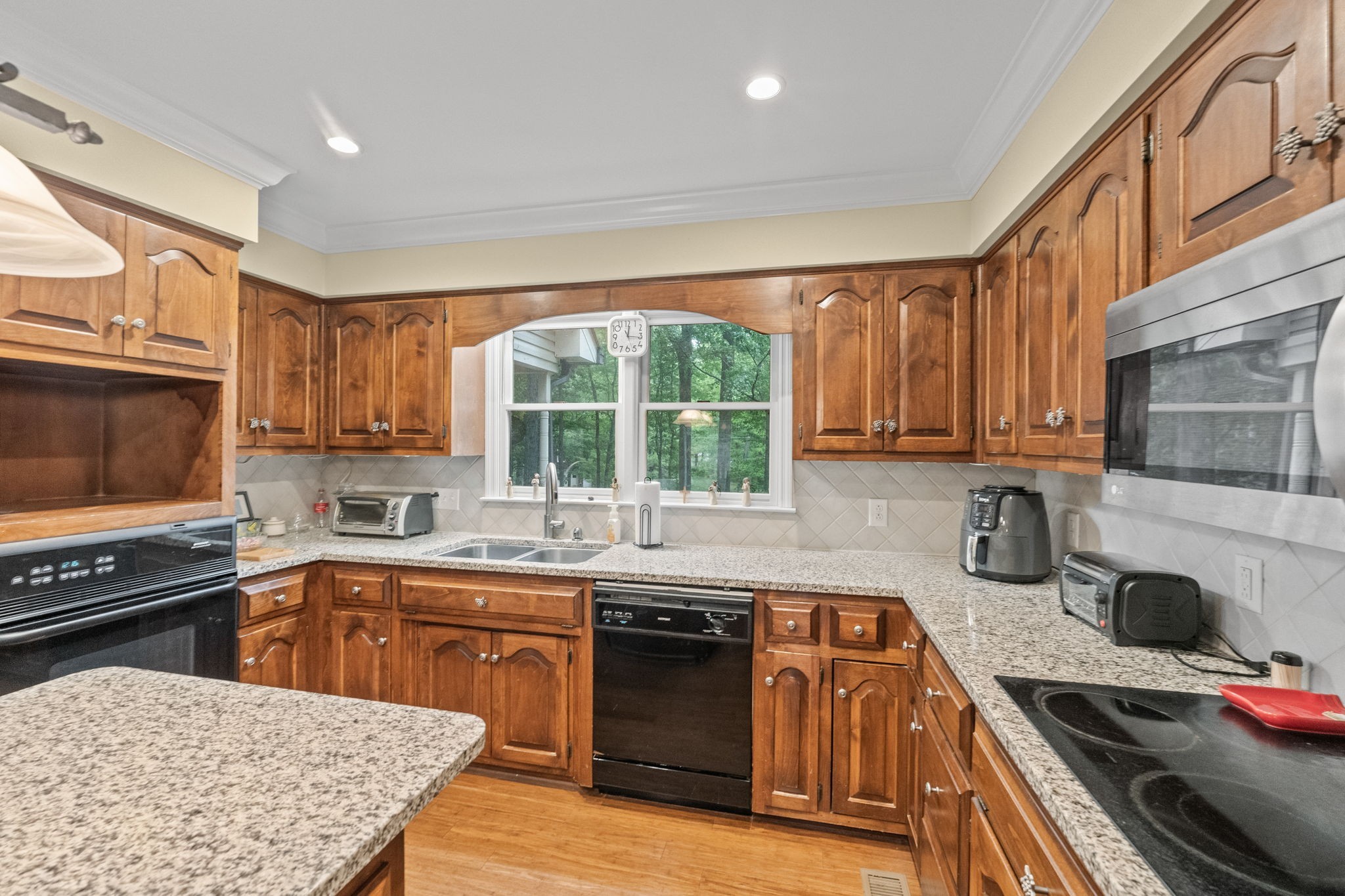 612 Fairway Trail Springfield, TN 37172 - Photo 35 of 50 a kitchen with stainless steel appliances a stove sink and cabinets