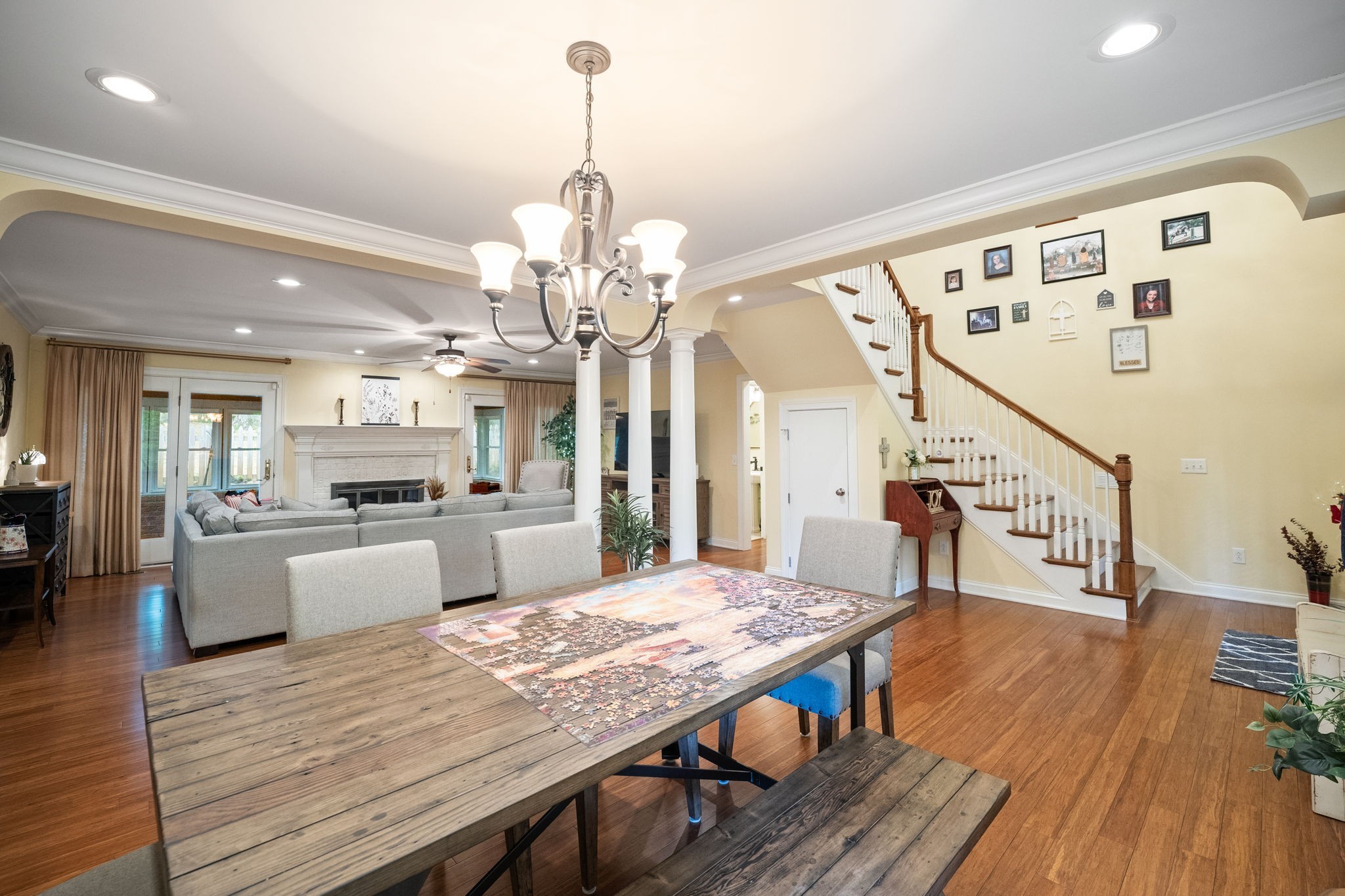 612 Fairway Trail Springfield, TN 37172 - Photo 8 of 50 a view of a dining room and livingroom with furniture wooden floor a chandelier