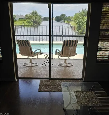 a view of sitting area with furniture and wooden floor
