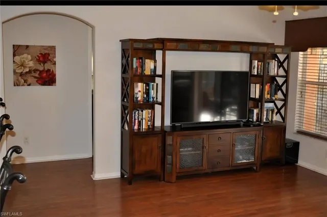 a dining room with furniture and wooden floor