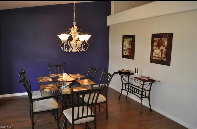 a living room with furniture and a lamp