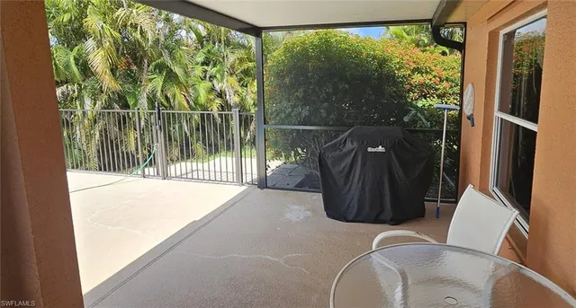 a view of a two chairs in the balcony