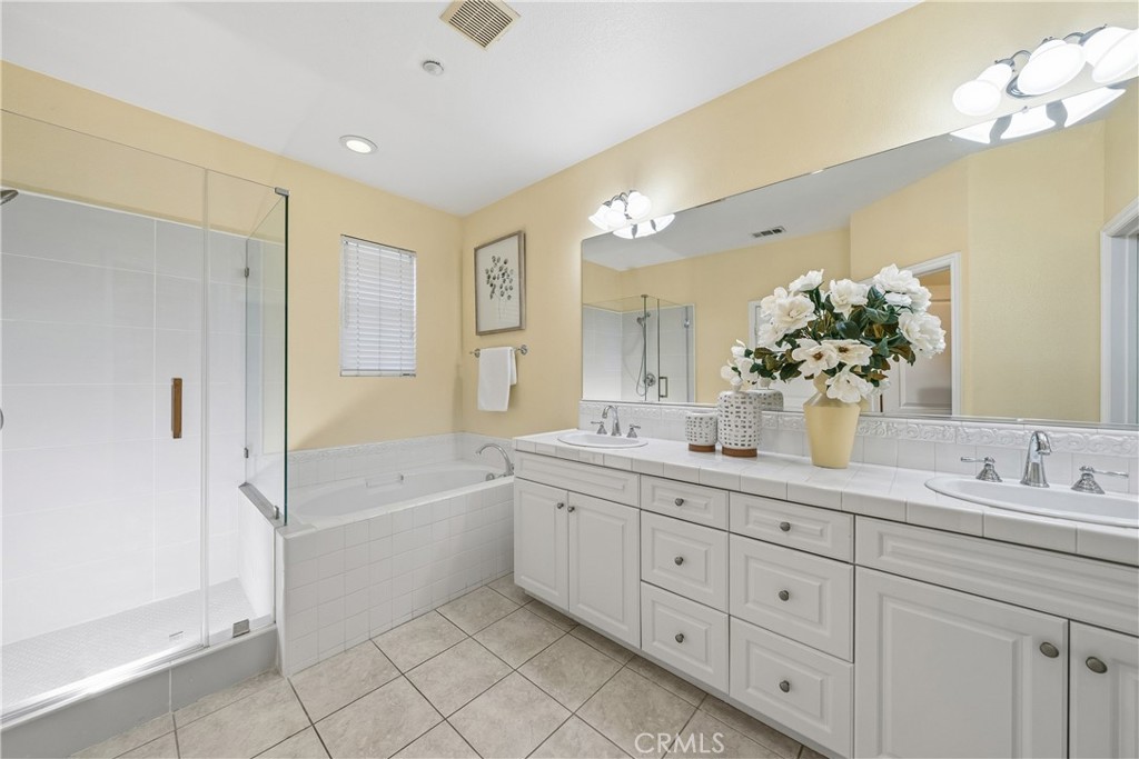 123 Chantilly Irvine, CA 92620 - Photo 20 of 31 a spacious bathroom with a granite countertop double vanity sink mirror bathtub and shower