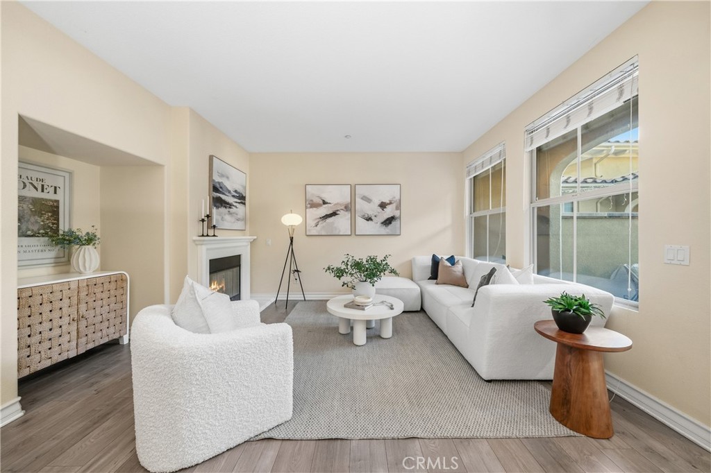 123 Chantilly Irvine, CA 92620 - Photo 8 of 31 a living room with furniture a fireplace and a potted plant