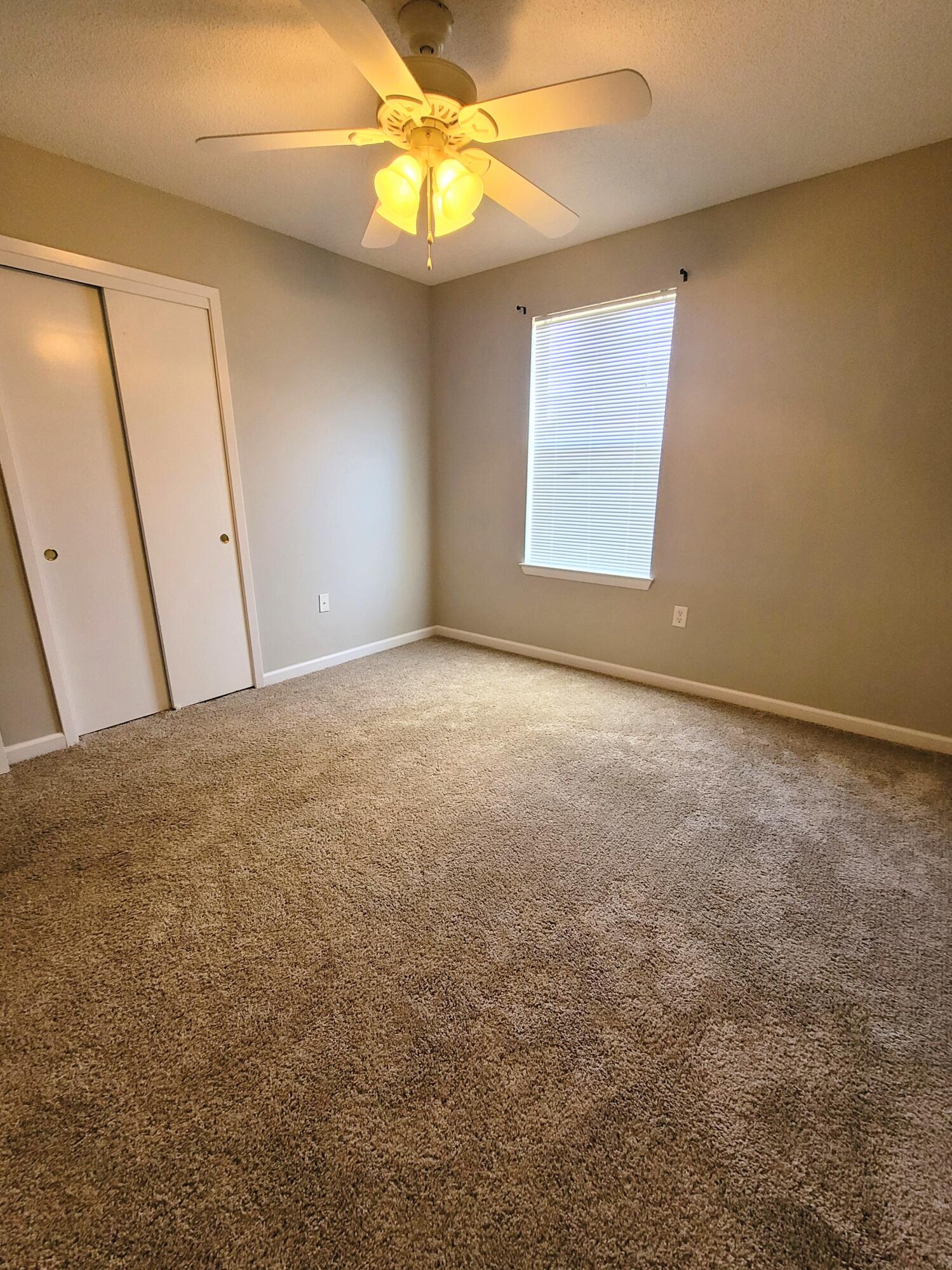 5496 Monterrey Road Crestview, FL 32539 - Photo 12 of 15 a view of an empty room with a window