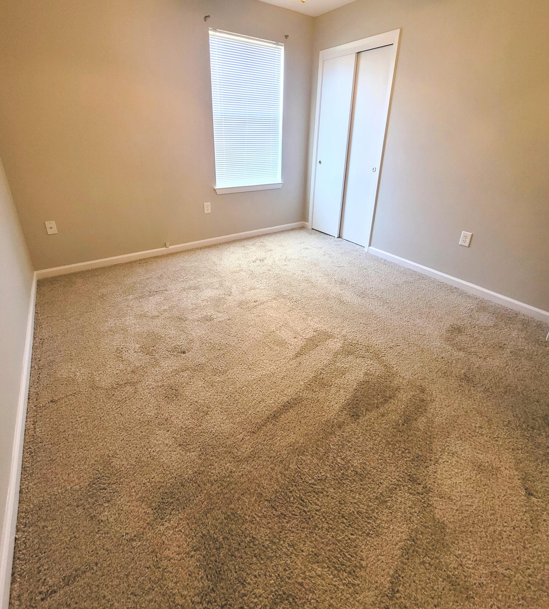 5496 Monterrey Road Crestview, FL 32539 - Photo 14 of 15 an empty room with windows