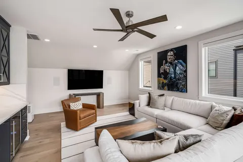 a view of a patio with table and chairs and potted plants