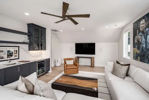 a bathroom with a granite countertop toilet sink and mirror