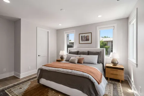 a living room with furniture and a rug