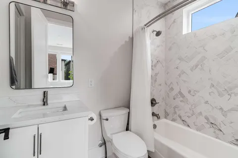 a view of a chairs setting in the backyard