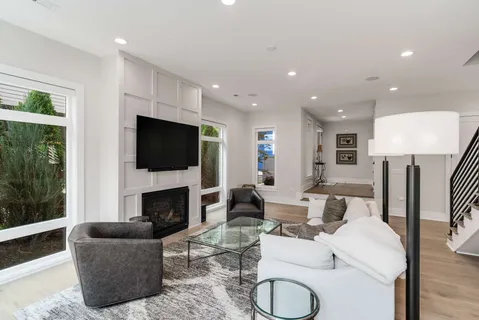 a living room with fireplace furniture and a flat screen tv