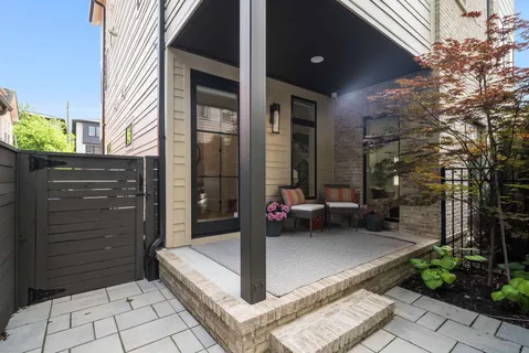 a view of a bench in the backyard