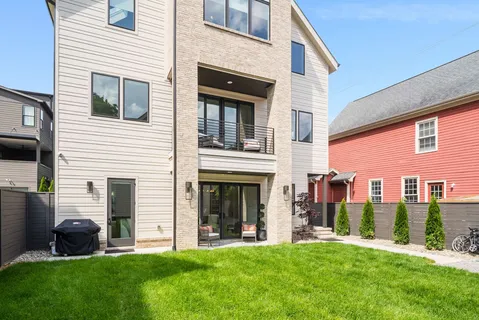 an aerial view of residential houses with outdoor space