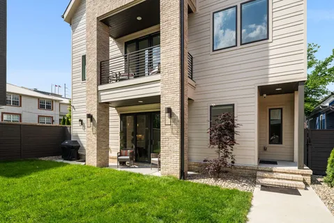an aerial view of residential houses with outdoor space