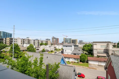 an aerial view of a kitchen with swimming pool and tennis court
