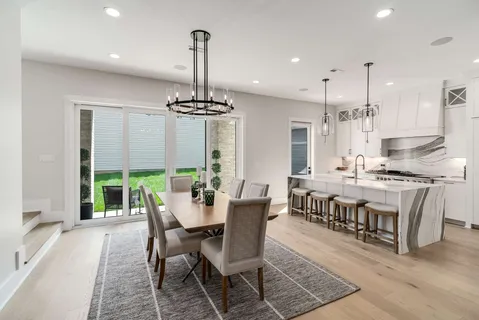 a kitchen with stainless steel appliances granite countertop a stove and a sink