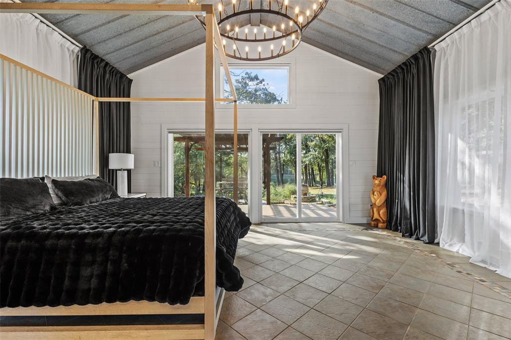 411 Hidden Meadows Lane Denison, TX 75021 - Photo 12 of 40 a bedroom with a bed and a window