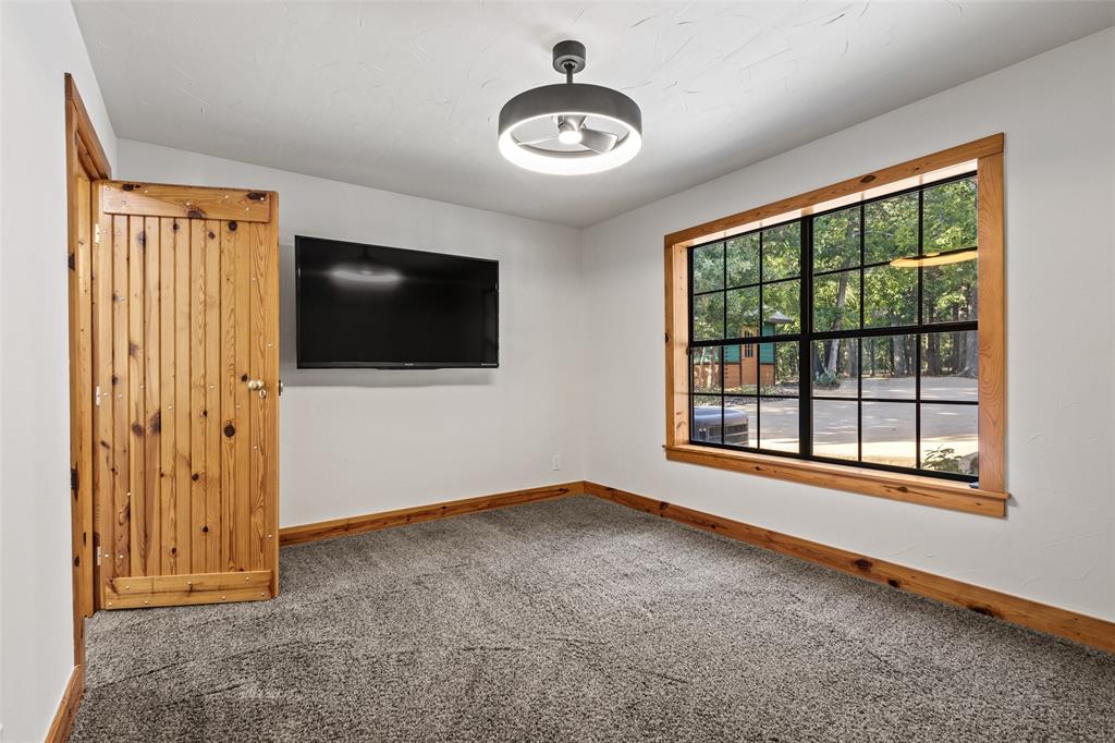 411 Hidden Meadows Lane Denison, TX 75021 - Photo 14 of 40 wooden floor in an empty room with a window