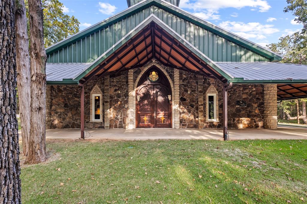 411 Hidden Meadows Lane Denison, TX 75021 - Photo 20 of 40 a front view of a house with a yard table and chairs