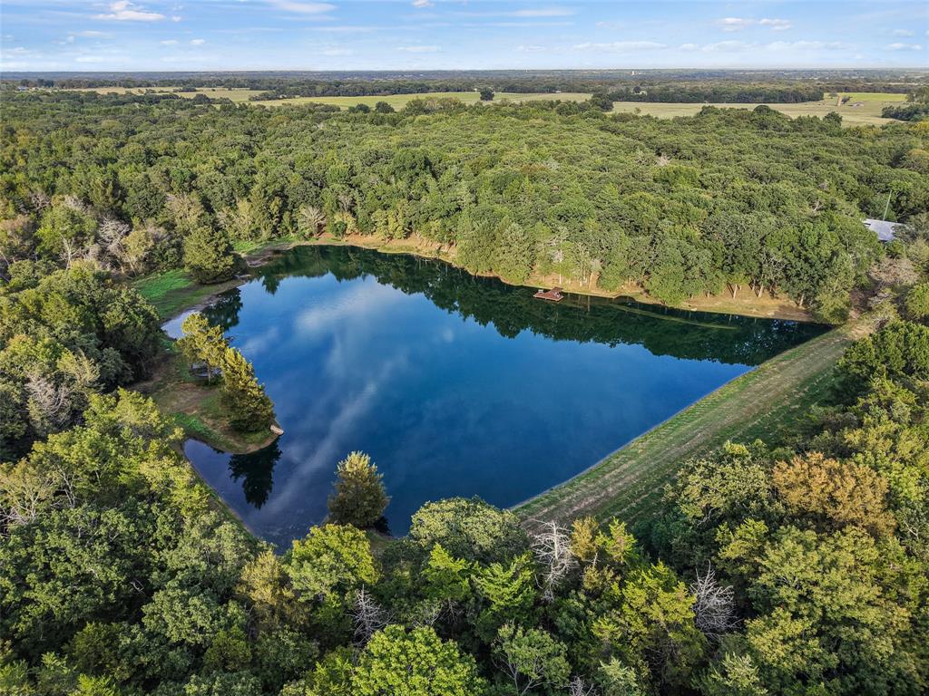 411 Hidden Meadows Lane Denison, TX 75021 - Photo 2 of 40 a view of a lake with a yard
