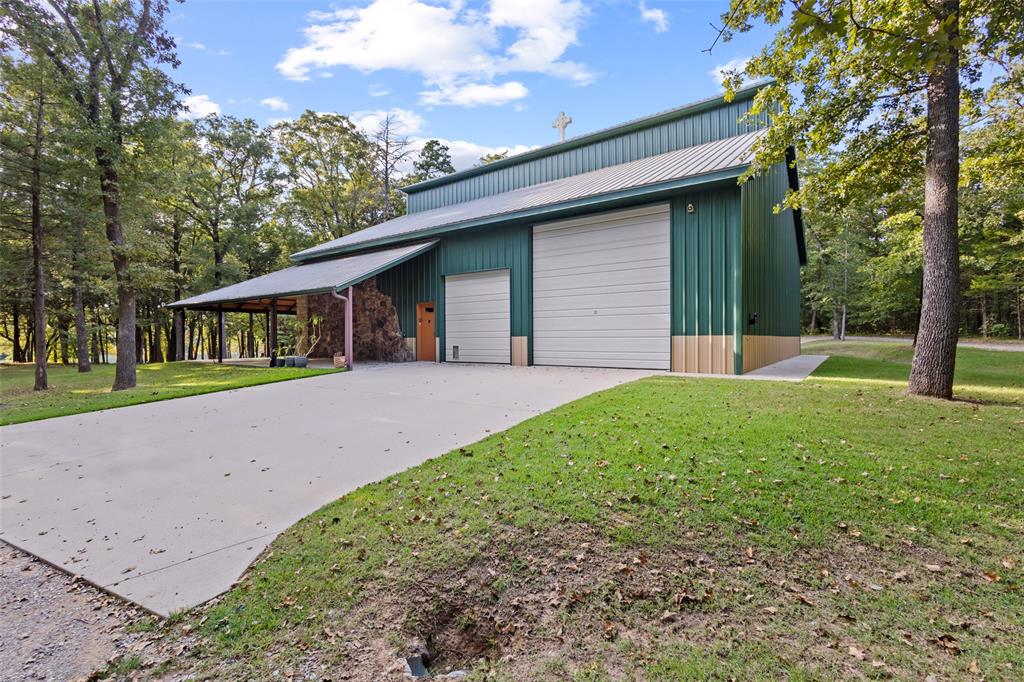 411 Hidden Meadows Lane Denison, TX 75021 - Photo 22 of 40 a front view of a house with garden