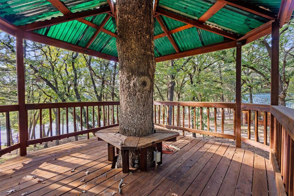 411 Hidden Meadows Lane Denison, TX 75021 - Photo 33 of 40 a view of a wooden deck with furniture