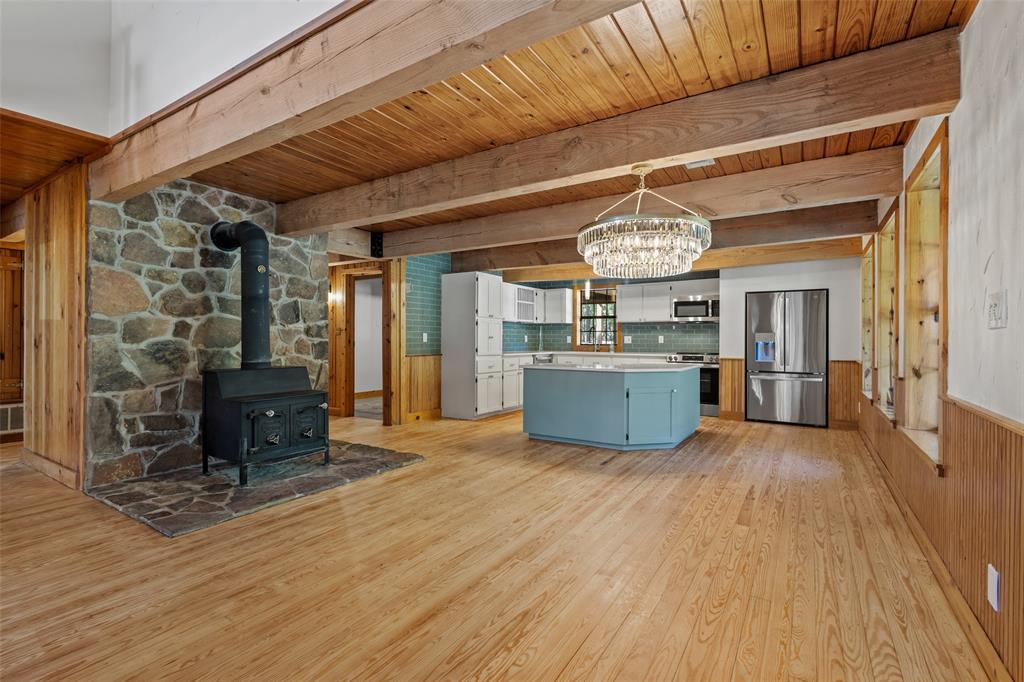 411 Hidden Meadows Lane Denison, TX 75021 - Photo 8 of 40 a view of a room with wooden floor furniture and kitchen view
