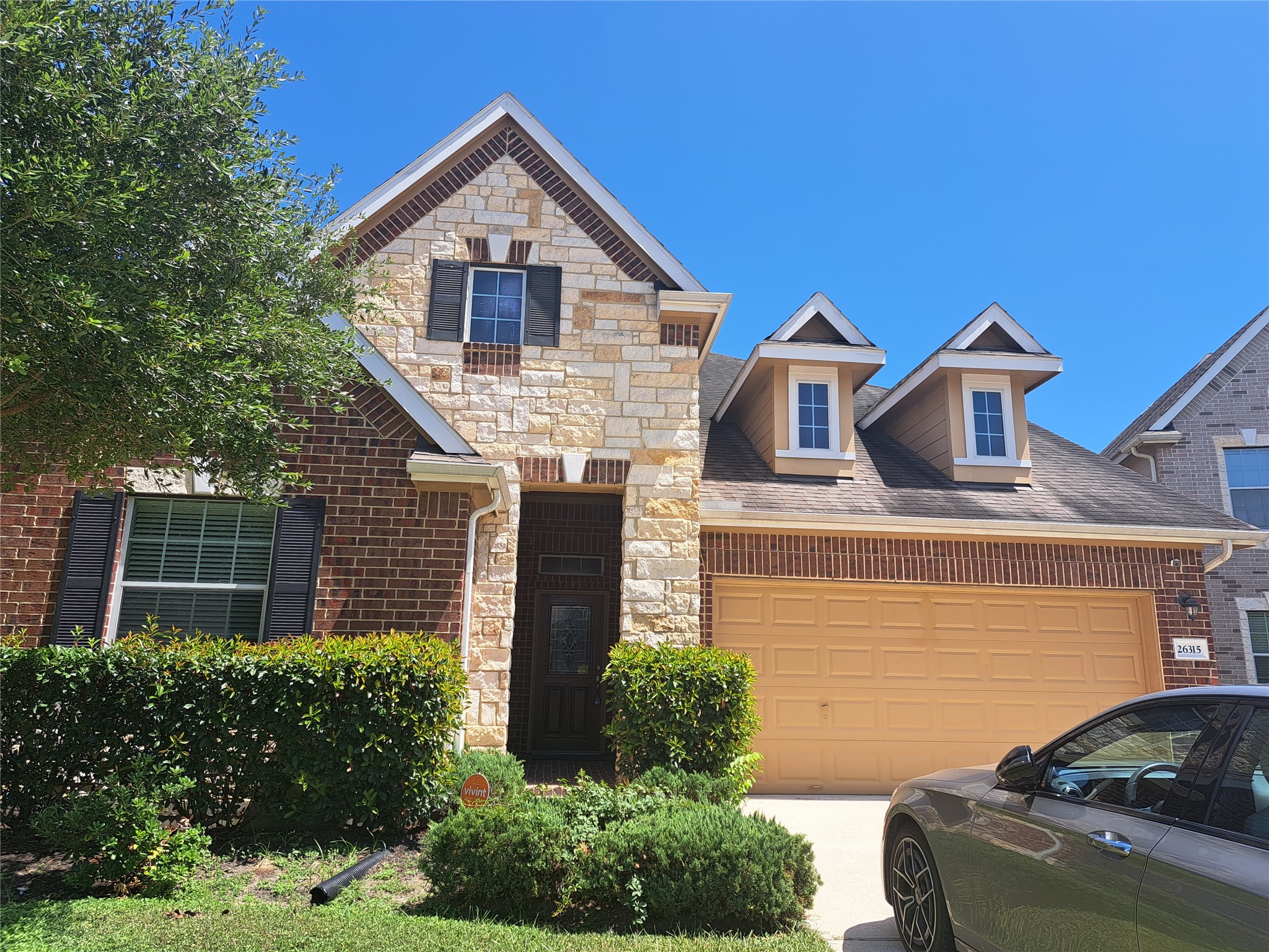 a front view of a house with yard