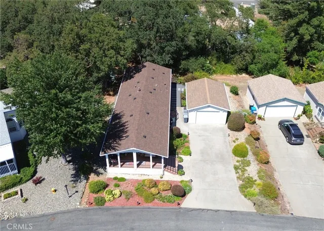 an aerial view of a house with a swimming pool