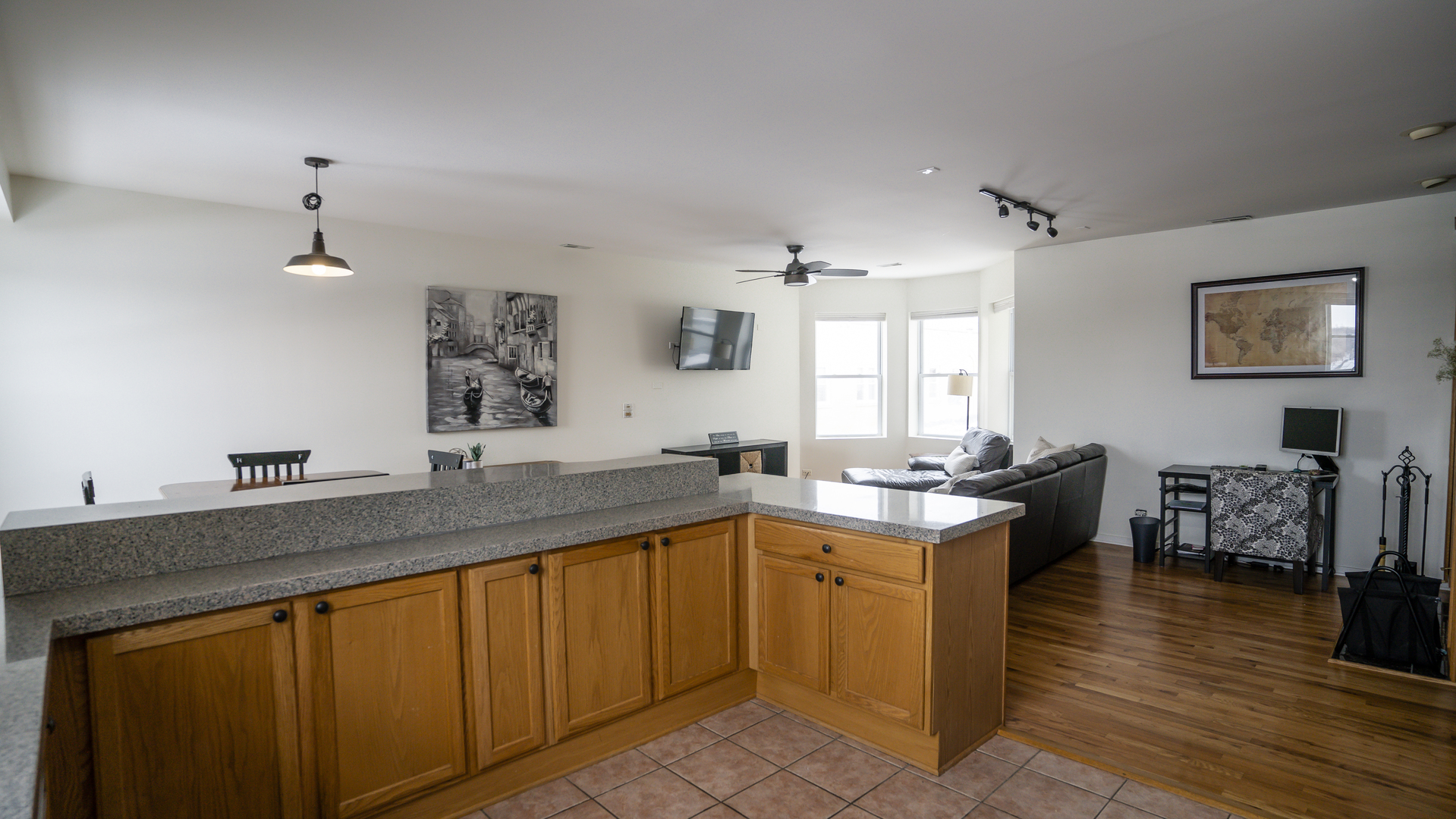4660 North Spaulding Avenue, Unit 3 Chicago, IL 60625 - Photo 3 of 29 a kitchen with granite countertop a sink stove and cabinets