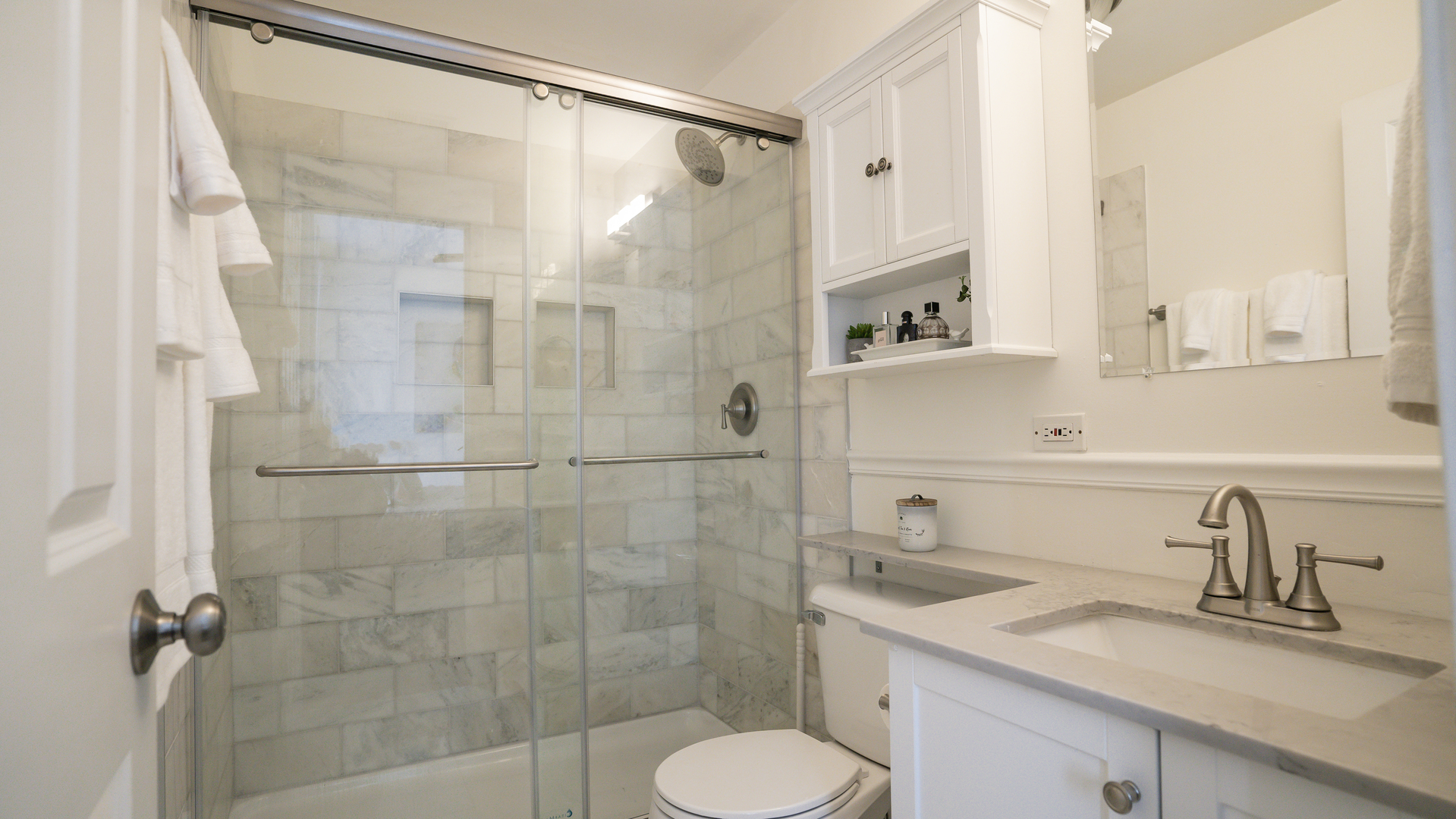 4660 North Spaulding Avenue, Unit 3 Chicago, IL 60625 - Photo 22 of 29 a bathroom with a granite countertop sink toilet and shower