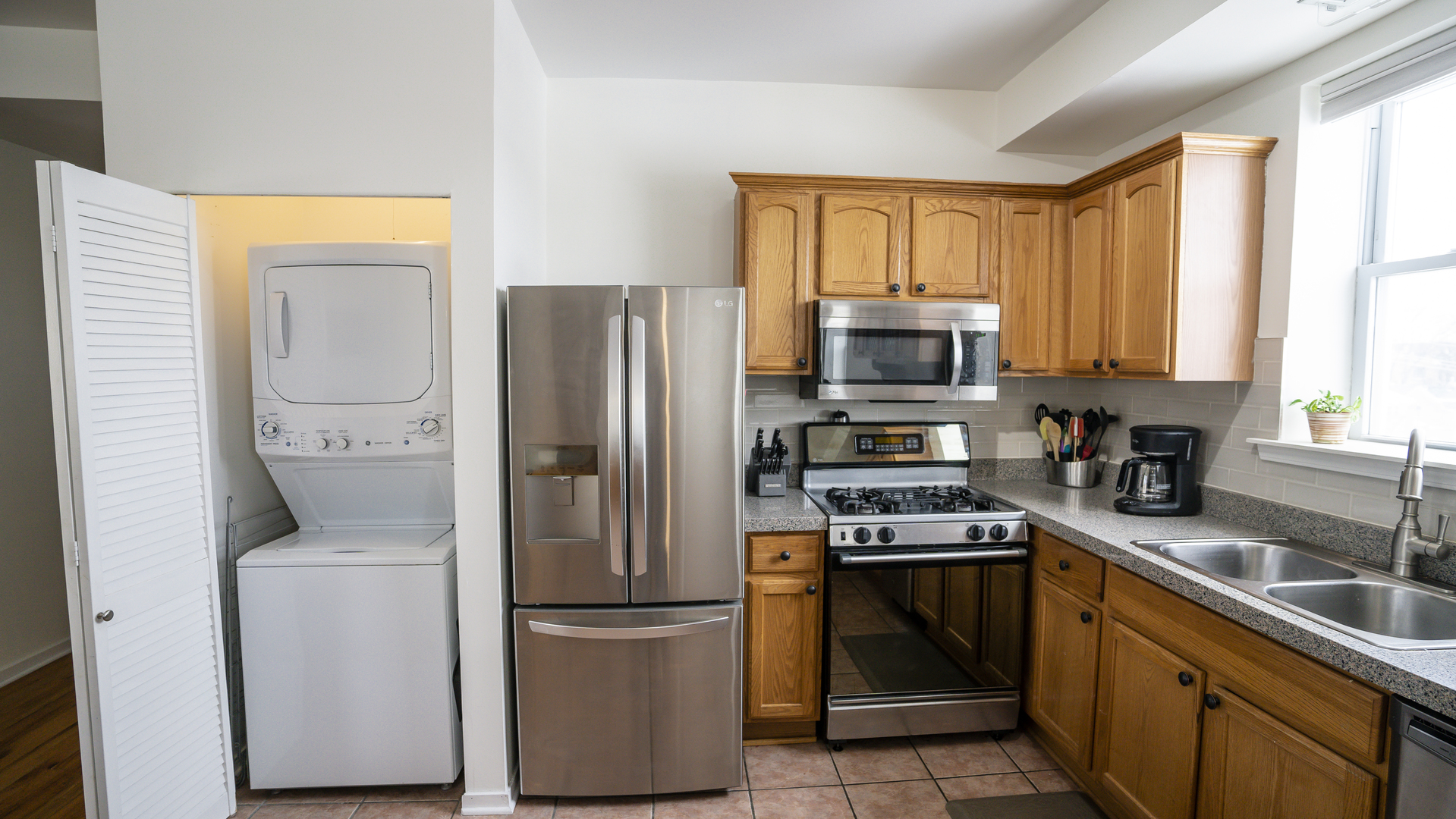 4660 North Spaulding Avenue, Unit 3 Chicago, IL 60625 - Photo 4 of 29 a kitchen with a refrigerator and a stove top oven