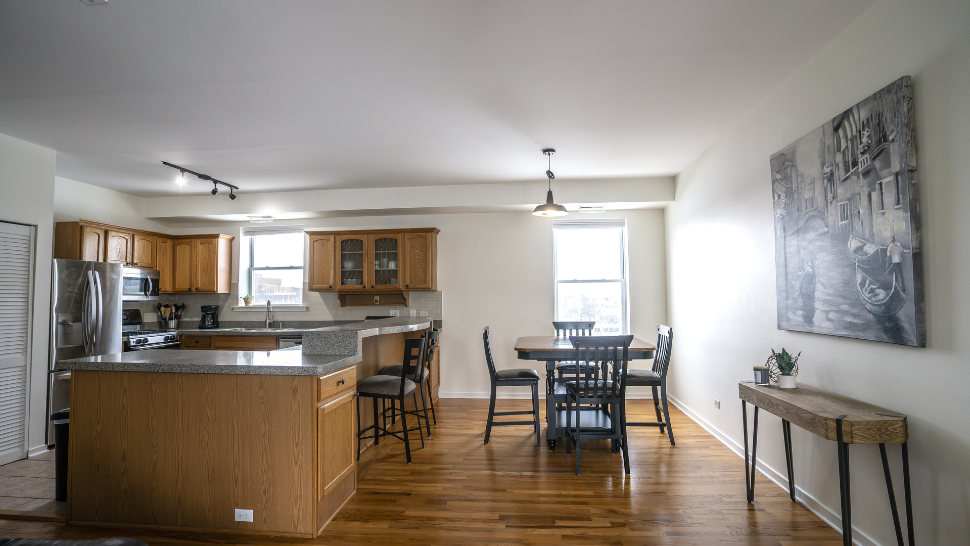 4660 North Spaulding Avenue, Unit 3 Chicago, IL 60625 - Photo 6 of 29 a view of a dining room with furniture window and wooden floor