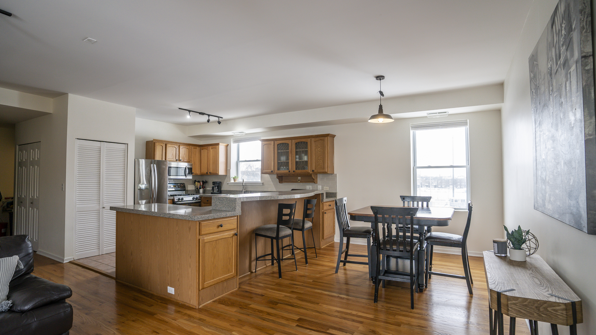 4660 North Spaulding Avenue, Unit 3 Chicago, IL 60625 - Photo 7 of 29 a view of a dining room with furniture and wooden floor