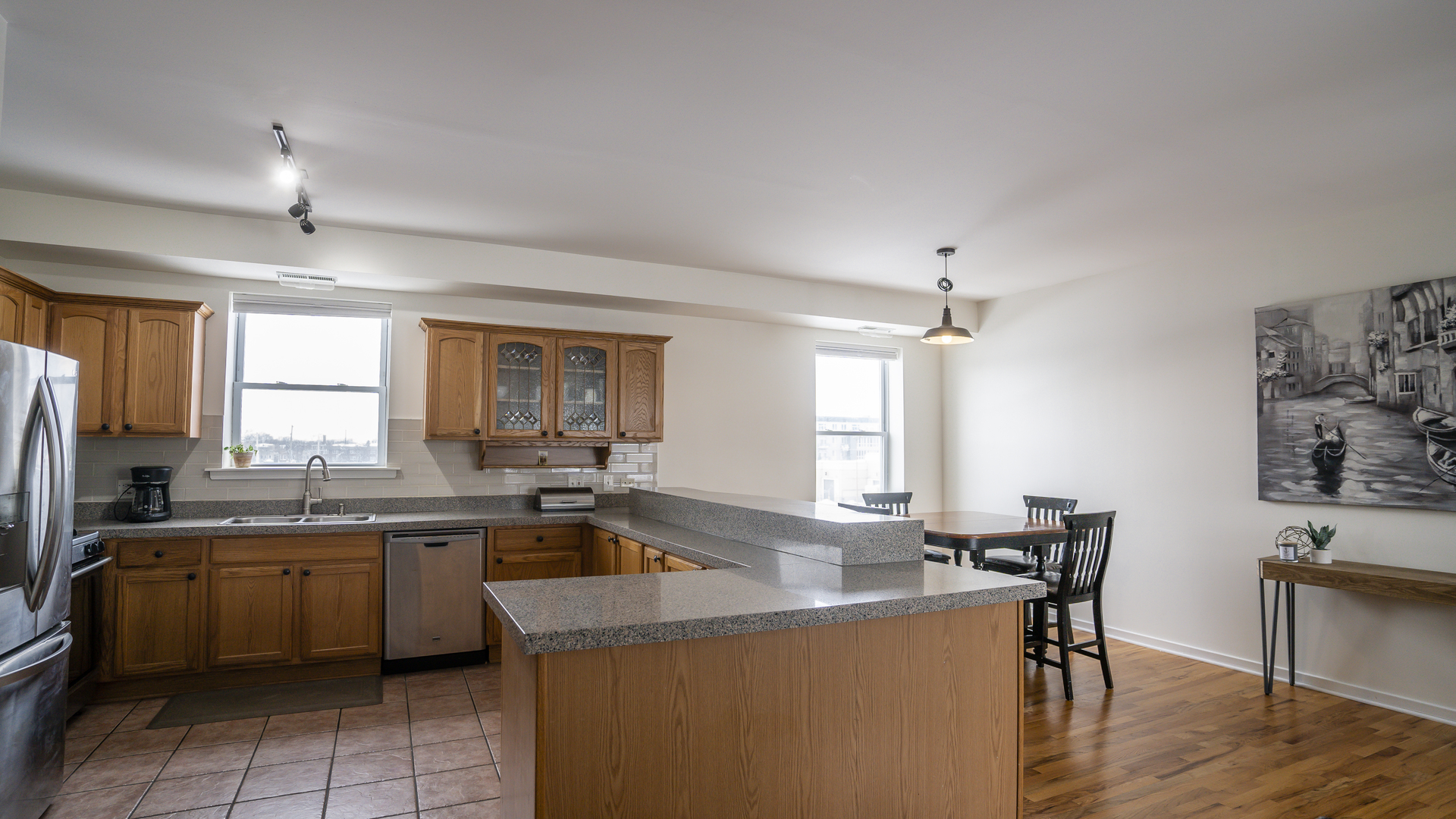 4660 North Spaulding Avenue, Unit 3 Chicago, IL 60625 - Photo 8 of 29 a kitchen with a sink window and cabinets