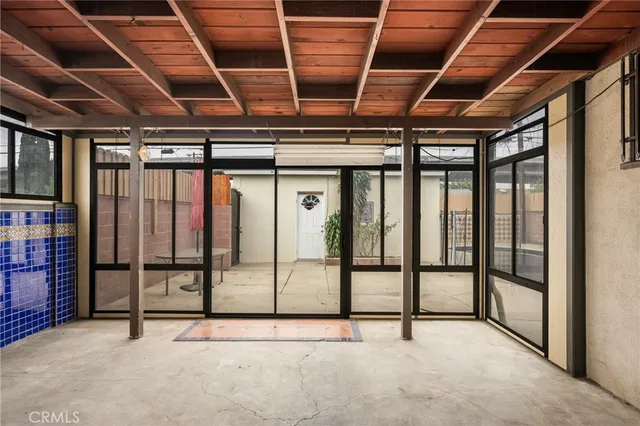 a view of an empty room with wooden roof