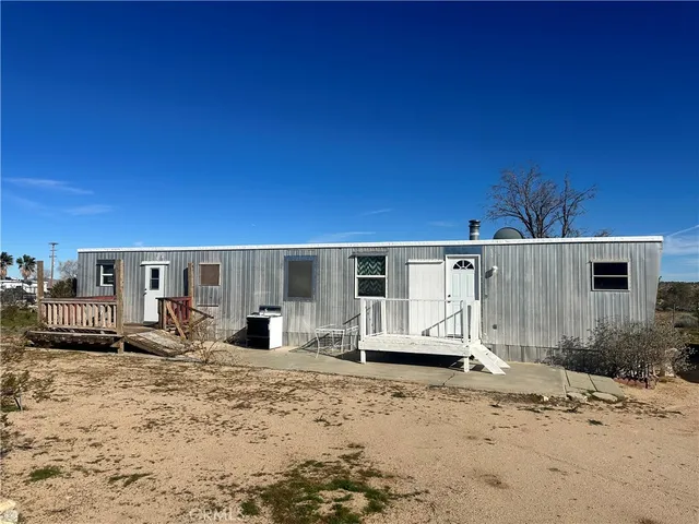 a view of a car park in front of house