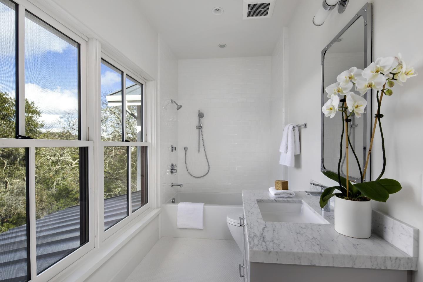135 Dean Road Woodside, CA 94062 - Photo 16 of 31 a dining room with furniture and a potted plant