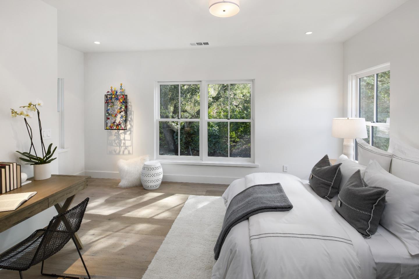 135 Dean Road Woodside, CA 94062 - Photo 17 of 31 a bedroom with a bed and a large window