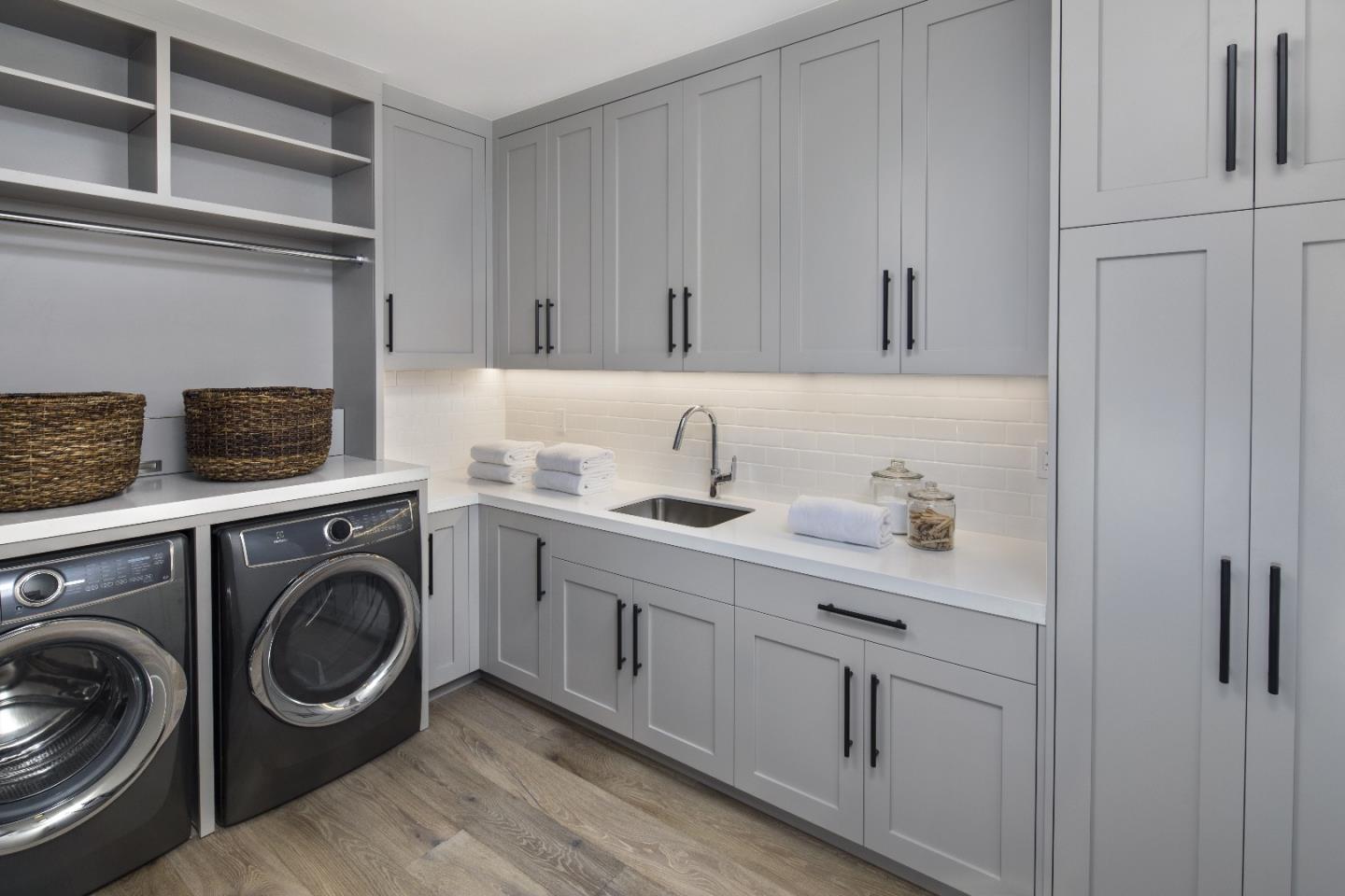 135 Dean Road Woodside, CA 94062 - Photo 18 of 31 a utility room with sink dryer and washer